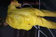 Watching sexy Sandra wearing a hot yellow shiny nylon rainwear combination during her housework (Pics)