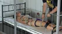 Hogtie with belts in jail
