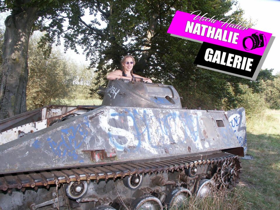 Nathalie poses on a Hotchkiss armored personnel carrier