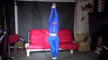 Sexy Sonja being tied and gagged overhead with ropes wearing a sexy blue shiny nylon pants and a jacket (Video)