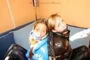 two of our archive girls bound and gagged in shiny nylon down jackets