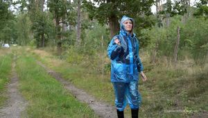 Miss Petra goes for a walk in PVC raingear and rubber boots