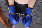 Cuffed in boxing gloves