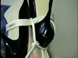 28 YR OLD BEAUTIFUL DOE EYED REBECCA IS HOG-TIED, CLEAVE GAGGED, WEARING BLACK LACEY LINGERIE ON BED (D52-10)