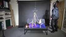 Marie M tightly bound and suspended in shiny nylon Downjacket