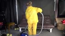 Watching sexy SANDRA vacuum cleaning the studio wearing a sexy yellow rainwear combination (Video)