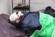 Jill tied, gagged and hooded wearing shiny nylon rainwear and a raincape over it (Pics)