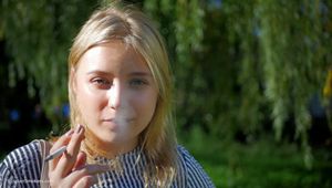 Pretty Polina is smoking 120 cork cigarette