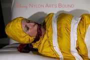 Watching Pia being tied and gagged with tape and a cloth gag wearing sexy yellow shiny nylon rainwear (Pics)