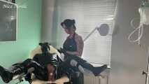 The dominatrix in a rubber apron and the rubber pig in the pain clinic