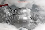 Simone in an shiny grey pvc sauna suit tied and gagged by Sophie in the bath tub (pics)