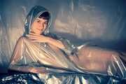 Naked under a PVC rain poncho