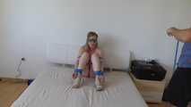 Maria roped on her bed 1/2