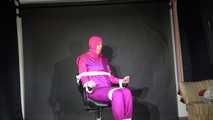 Sexy Pia tied and gagged with ropes and a clothgag on a hairdresser´s chair wearing a sexy pink shiny nylon downsuit (Video)