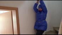 Jill tied, gagged and hooded in a stairway with cuffs wearing a sexy blue PAMY jacket and a rain pants (Video)