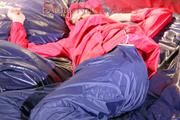 Sonja lolling on bed with a sexy blue rain pants and a red rain jacket enjoying herself and the hood in this material (Pics)