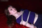 Agnes hogtied on bed