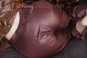 Watching ***SONJA*** wearing a sexy brown shiny nylon rainwear combination preparing her bed an lolling in the bed (Pics)