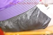 Mara tied and gagged with cable ties on a chair wearing a sexy shiny silver leggings and a shiny nylon shorts in black/white as well as a black purple rain jacket (Pics)