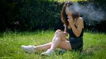 Arina is smoking 120mm cigarettes outdoors