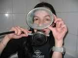 Sandrine scuba diving in the bath tub wearing a Swatch