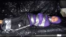 SANDRA tied and gagged with tape on a sofa wearing a sexy black shiny nylon pants and a purple rain jacket (Video)