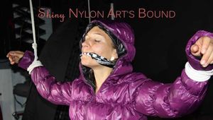 Sandra tied, gagged and hooded complete overhead with ropes and a clothgag wearing a sexy purple down jacket and a rain pant (Pics)