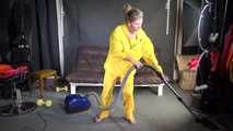 Watching sexy SANDRA vacuum cleaning the studio wearing a sexy yellow rainwear combination (Video)