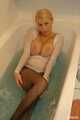 Busty Anna takes a hot bath in her pantyhose