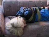 Beautiful archive girl tied, gagged and hooded in several situations wearing shiny nylon rainwear (Video)