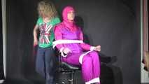 Sexy Pia tied and gagged with ropes and a clothgag on a hairdresser´s chair wearing a sexy pink shiny nylon downsuit (Video)