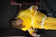 Sandra being tied and gagged on a hairdresser´s chair wearing sexy yellow shiny nylon rainwear being double hooded (Pics)