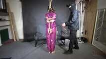 Marie M tied and gagged in a PVC suit