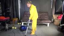 Watching sexy SANDRA vacuum cleaning the studio wearing a sexy yellow rainwear combination (Video)