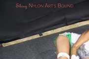 Watching sexy Sandra wearing a sexy green shorts and a white top being tied and gagged on the floor with ropes and a cloth gag (Pics)