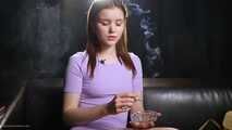18 aged girl is smoking two strong cork cigarettes