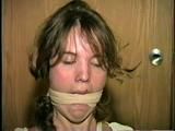 SWEET SHY HEATHER IS MOUTH STUFFED, ACE BANDAGE CLEAVE GAGGED, BAREFOOT, TOES TIED AND BOUND TO A CHAIR (D46-13)