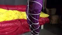 Watching sexy Sonja wearing a supersexy purple shiny nylon rainwear combination being tied and gagged overhead with ropes and a clothgag (Video)