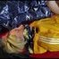 Sonja tied and gagged with a bar and cuffs in bed wearing a very small, hot blue shiny nylon shorts and a yellow rain jacket (Video)
