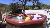 a jakuzzi full of balloons