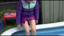 Watching Mara wearing a supersexy purple down skirt and a purple down jacket cleaning the swimming pool and playing with water (Video)