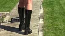 Watching Pia sweeping the terrace wearing a sexy black shiny nylon shorts, a striped top and black rubber boots (Video)