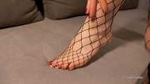Füße und Netzstrümpfe