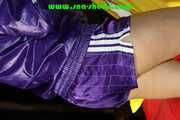 Sandra preparing her shiny nylon bed wearing sexy purple shiny nylon shorts and a purple shiny nylon rain jacket (Pics)