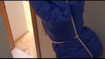 Jill tied, gagged and hooded in a stairway with cuffs wearing a sexy blue PAMY jacket and a rain pants (Video)