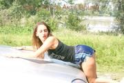 Stella tied and gagged outdoor in an car posing for you wearing a shiny nylon shorts and a top (Pics)