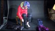 Mara wearing sexy purple rainwear trying on a black down pants and a red down jacket infront of the camera (Video)