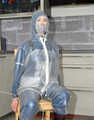 Miss J ziptied and gagged in two layers raingear