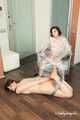 Anni Bay and Dakota - one wrapped to the armchair, another hogtaped on the floor