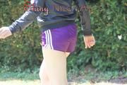 Mara wearing a purple shiny nylon shorts and a black rain jacket playing soccer (Pics)